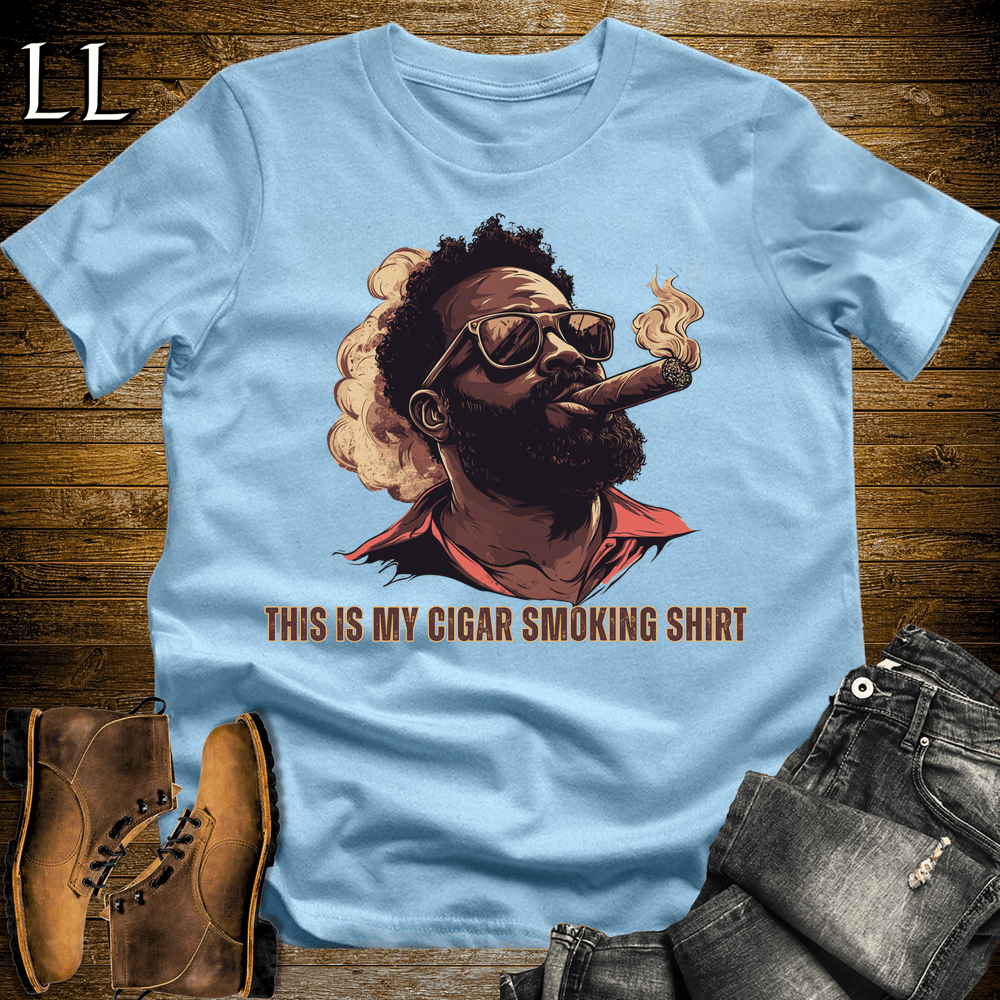 Black man in sunglasses smoking a cigar graphic tee in Light Blue — The Cigar Smoking Shirt by Legacy Layers