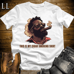 Black man in sunglasses smoking a cigar graphic tee in White — The Cigar Smoking Shirt by Legacy Layers